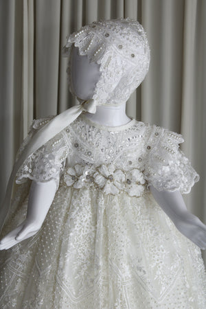 Full-length view of the Aytana christening gown in soft pearl tone