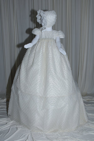 Amira baptism gown for baby girl with cascading pearl embellishments and matching bonnet