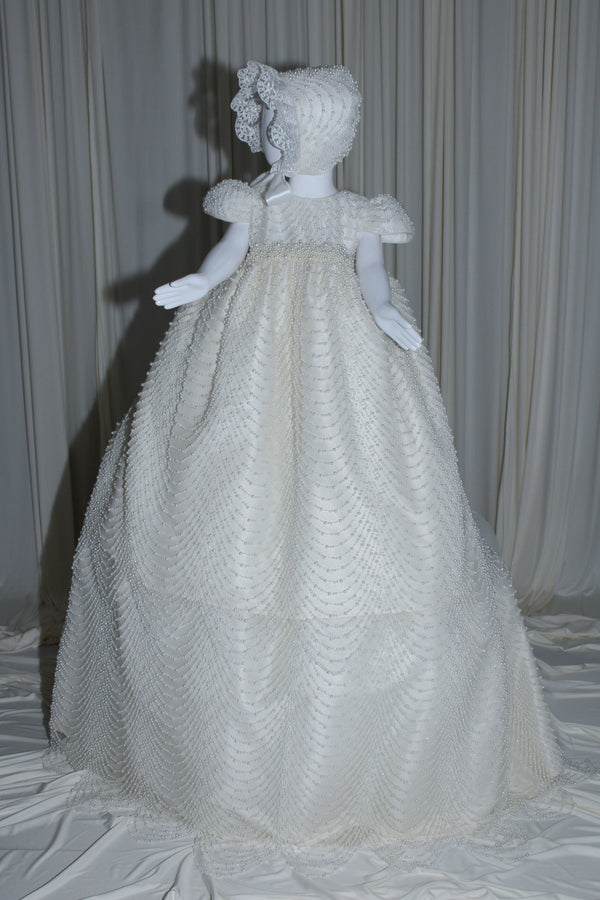 Amira baptism gown for baby girl with cascading pearl embellishments and matching bonnet