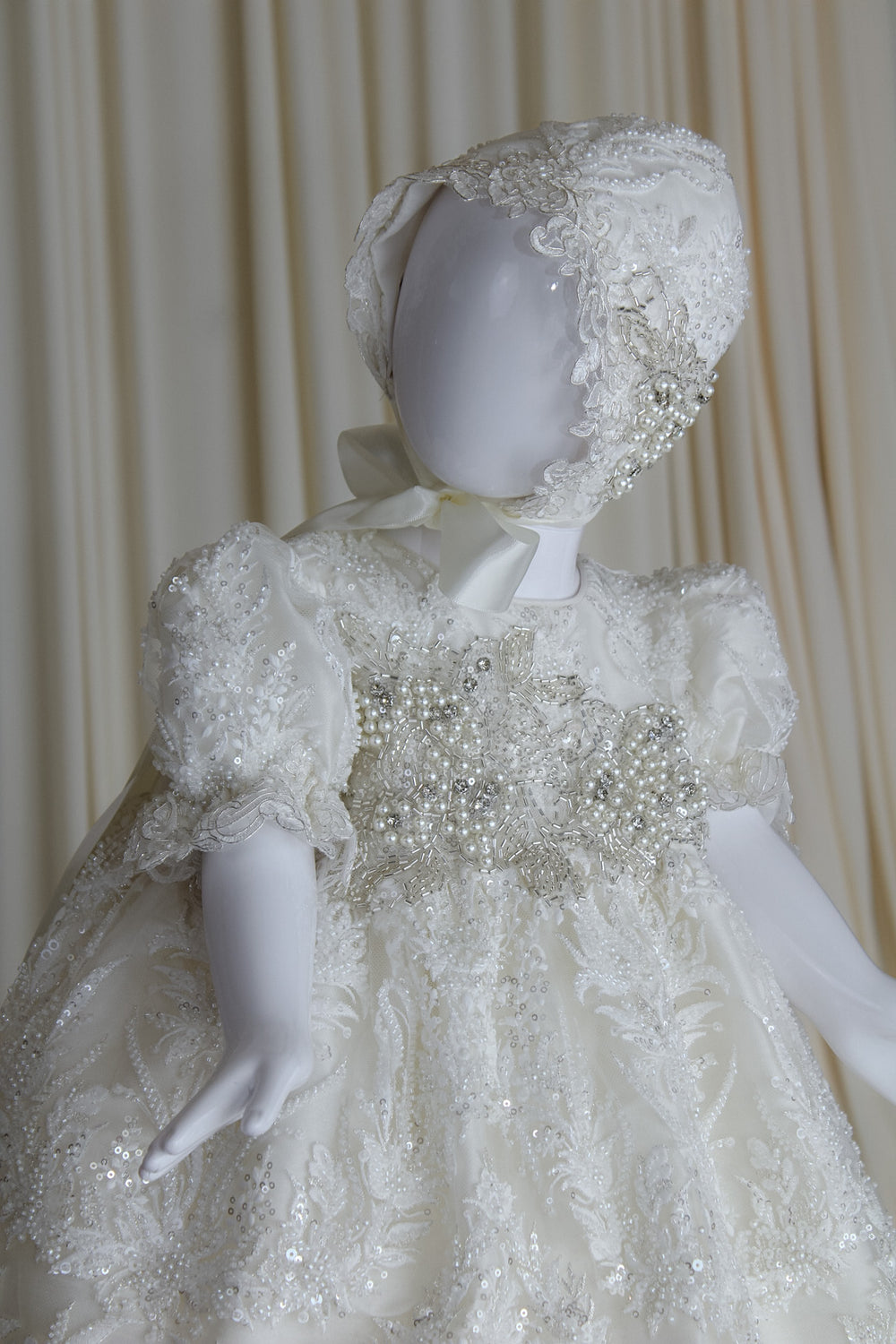 Adeline baptism gown with dimensional floral appliqués and matching bonnet