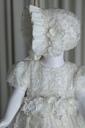 Anahi baptism gown for baby girl with embroidered lace and floral waist detail