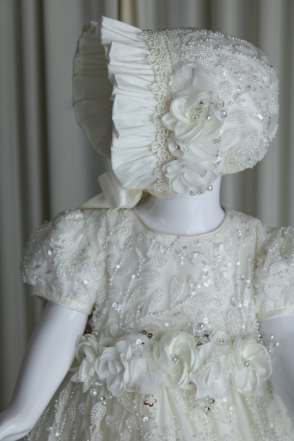 Anahi baptism gown for baby girl with embroidered lace and floral waist detail