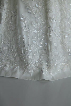 Close view of the Anahi gown embroidered lace and sequin detail